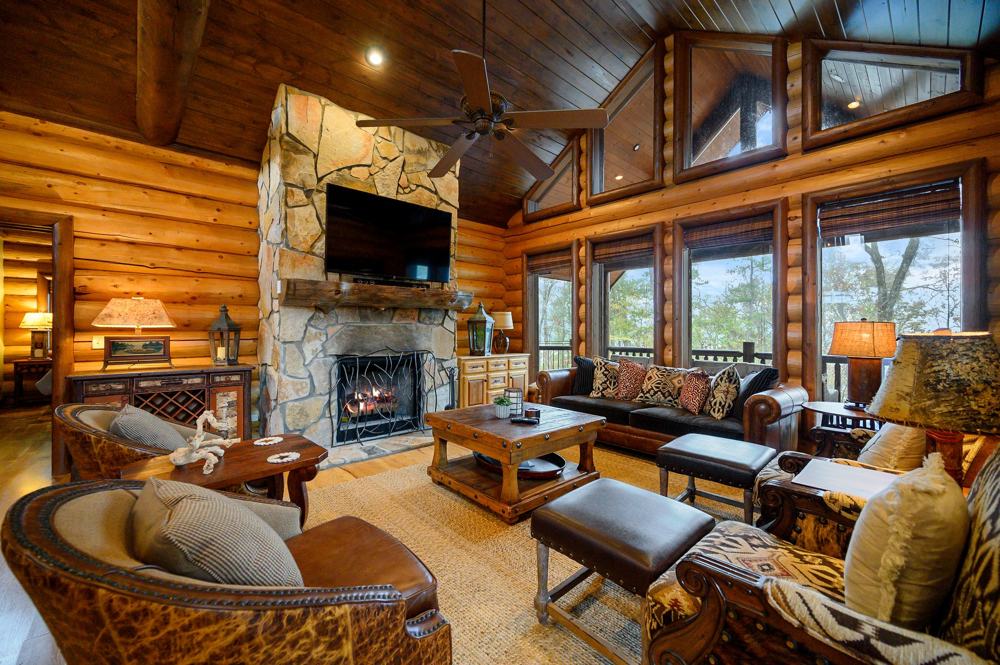 Main lodge great room with floor-to-ceiling stone fireplace