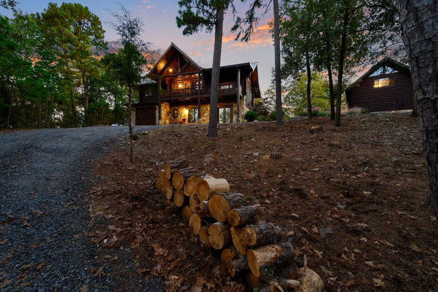 Drive up to the cabins with stacked firewood